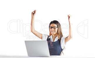 Happy businesswoman using laptop and raising arms