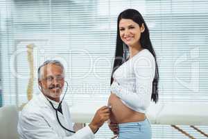 Doctor examining pregnant woman