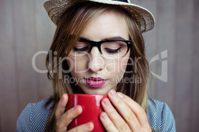 Pretty blonde woman having coffee