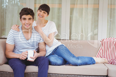 Young couple sitting on sofa