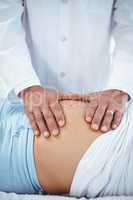 Doctor examining pregnant woman