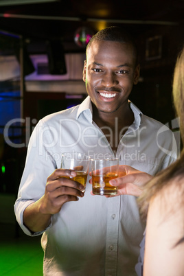 Portrait of man toasting his whisky glass