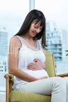 Pregnant woman sitting on chair