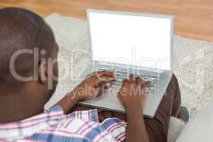 Man using laptop in living