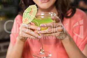 Pretty woman holding a cocktail