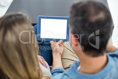 Couple using digital tablet