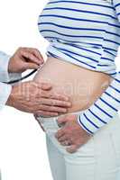 Doctor examining pregnant woman