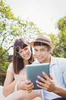 Young couple looking at digital tablet