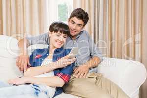 Couple at home relaxing on the sofa