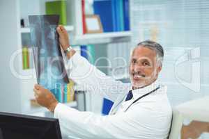 Doctor checking a x-ray report