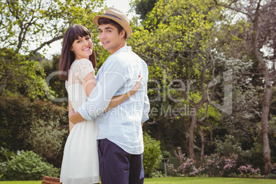 Young couple embracing outdoors Young couple embracing outdoors