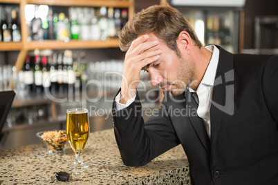 Tired man having a beer