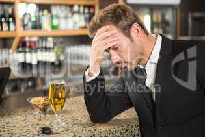 Tired man having a beer