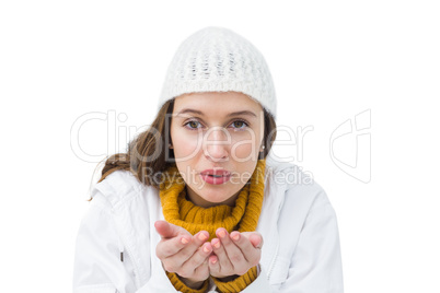 Pretty brunette sending blowing kiss