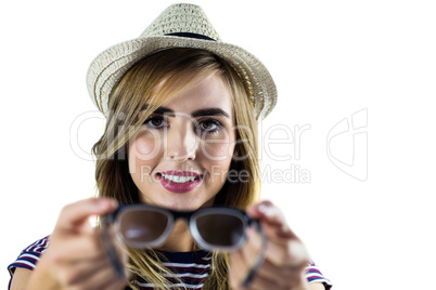 Smiling woman holding glasses Smiling woman holding glasses