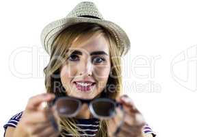 Smiling woman holding glasses