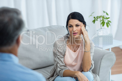 Therapist talking to worried woman