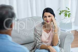 Therapist talking to worried woman