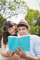 Young couple reading a novel