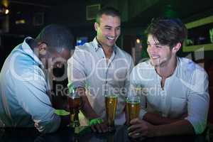 Group of men partying with glass of beer