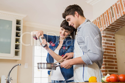 Woman pouring salt into utensil