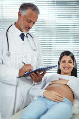 Pregnant woman interacting with doctor