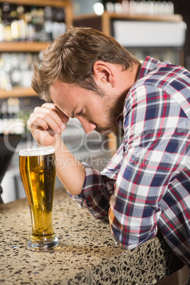 Tired man having a beer