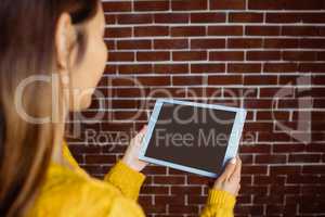 Smiling asian woman using tablet