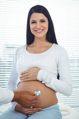 Doctor examining pregnant woman