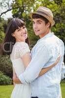 Young couple embracing outdoors