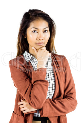 Serious businesswoman holding her chin