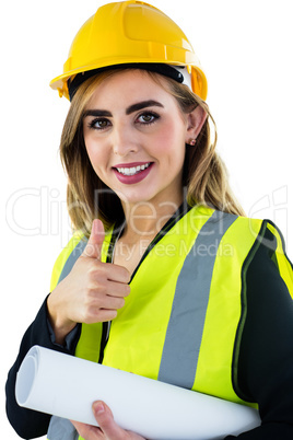 Smiling woman holding construction plan