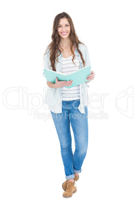 Portrait of female student reading a book