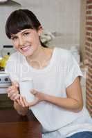 Young woman having a cup of coffee