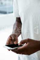 Man text messaging on mobile phone