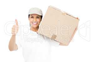 Delivery woman carrying a package and showing thumbs up