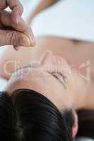 Pregnant woman in an acupuncture therapy