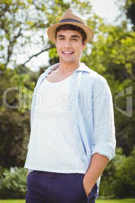 Young man standing in garden