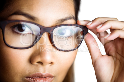 Close up view of a businesswoman holding her eyeglasses