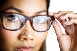 Close up view of a businesswoman holding her eyeglasses