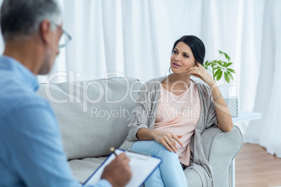 Pregnant woman talking to doctor