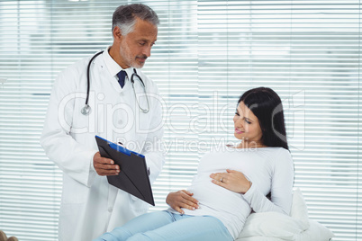 Doctor examining pregnant woman