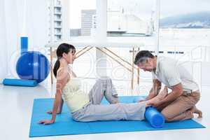 Physiotherapist giving physiotherapy to pregnant woman