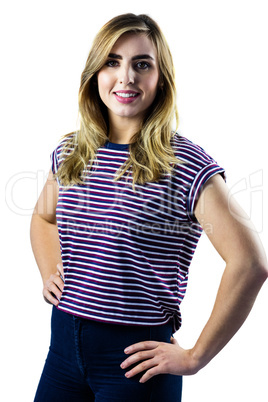 Smiling woman with hands on hips posing for camera