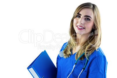 Smiling nurse holding binder