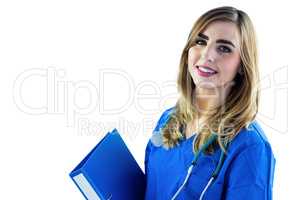 Smiling nurse holding binder