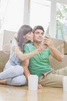 Young couple using mobile phone