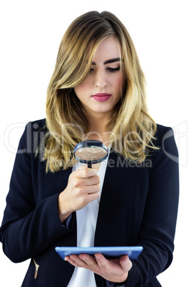 Woman using magnifying glass