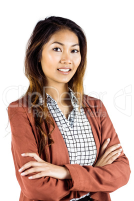 Smiling businesswoman with crossed arms