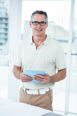 Physiotherapist using digital tablet